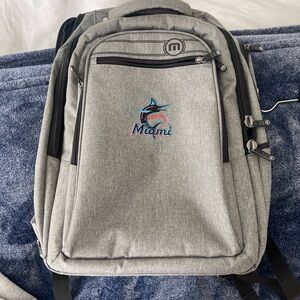 Travis Mathew Gray Backpack with Miami Marlins Embroidery